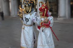 Traditionally dressed Venice carnival person in Piazza San Marco, Italy