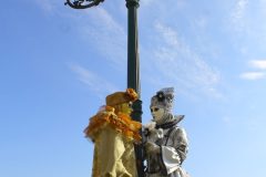 couple in carnival costume on background gondolas